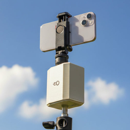 Pitchwise Mount on a tripod against a blue sky with clouds