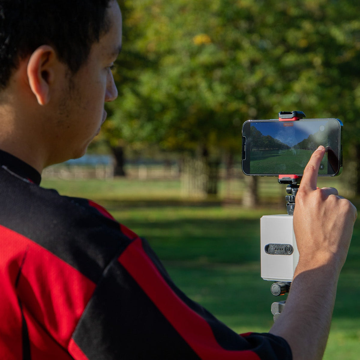 Jeremy using a smartphone to control a Pitchwise Mount