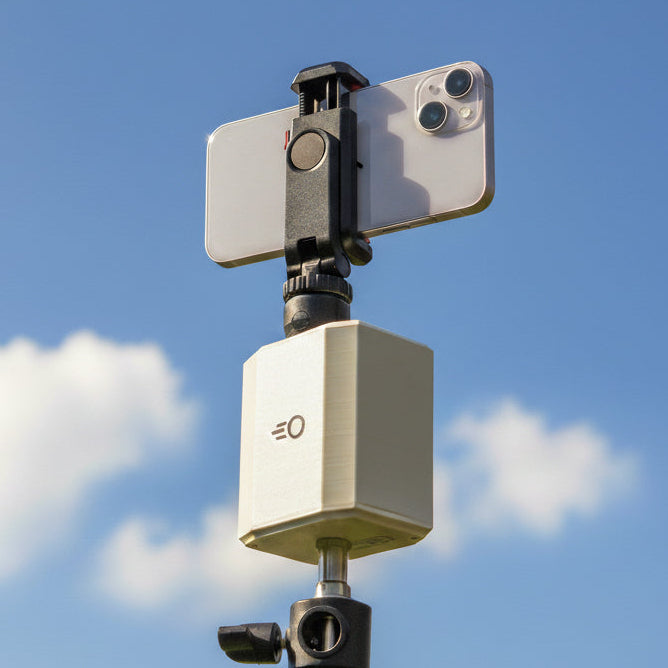 Pitchwise Mount on a tripod against a blue sky with clouds